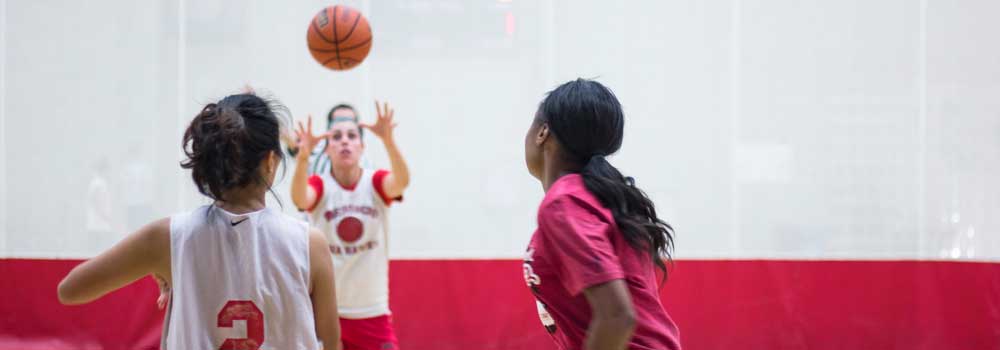 Women playing basketball on ARC Courts